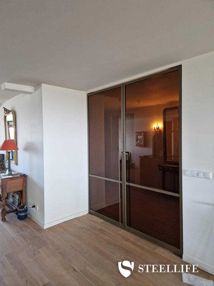 Stalen bronzen taatsdeuren met brons glas